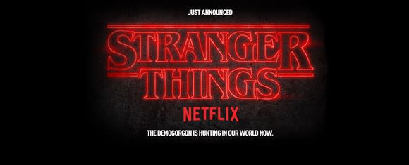 Sign reads "Just announced. Stranger Things. Netflix. The Demogorgan in hunting in our world now."