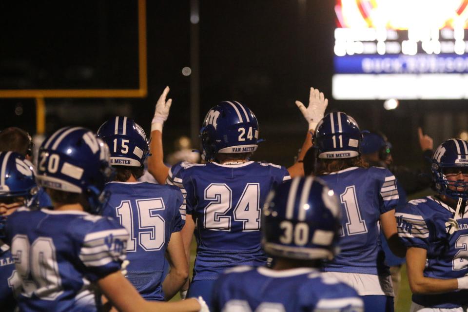 Van Meter players celebrate during the second round of 1A playoffs against Woodward-Granger at Bulldog Stadium on Friday, Oct. 28, 2022.