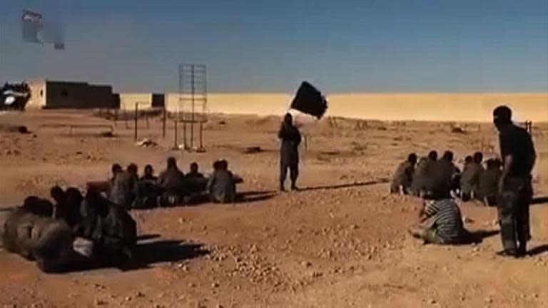 An image grab taken from a video released by Islamic State group's official Al-Raqqa site via YouTube on September 23, 2014, allegedly shows Islamic State (IS) group recruits at a training ground in an unknown location