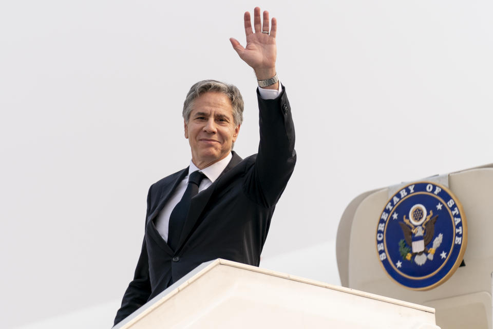 Secretary of State Antony Blinken waves as he boards his plane at N'Djili International Airport in Kinshasa, Congo, Wednesday, Aug. 10, 2022, to travel to Rwanda. Blinken is on a ten day trip to Cambodia, Philippines, South Africa, Congo, and Rwanda. (AP Photo/Andrew Harnik, Pool)