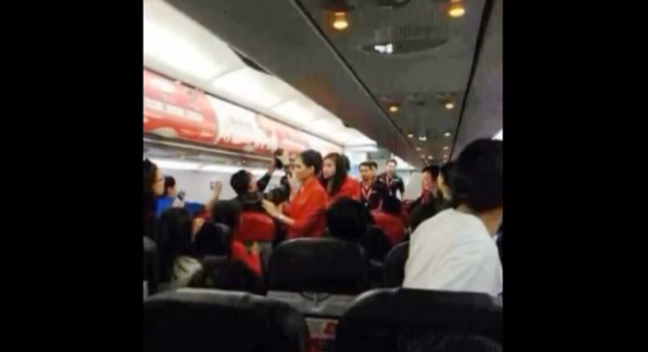 Plane passengers scald flight attendant with hot water and noodles