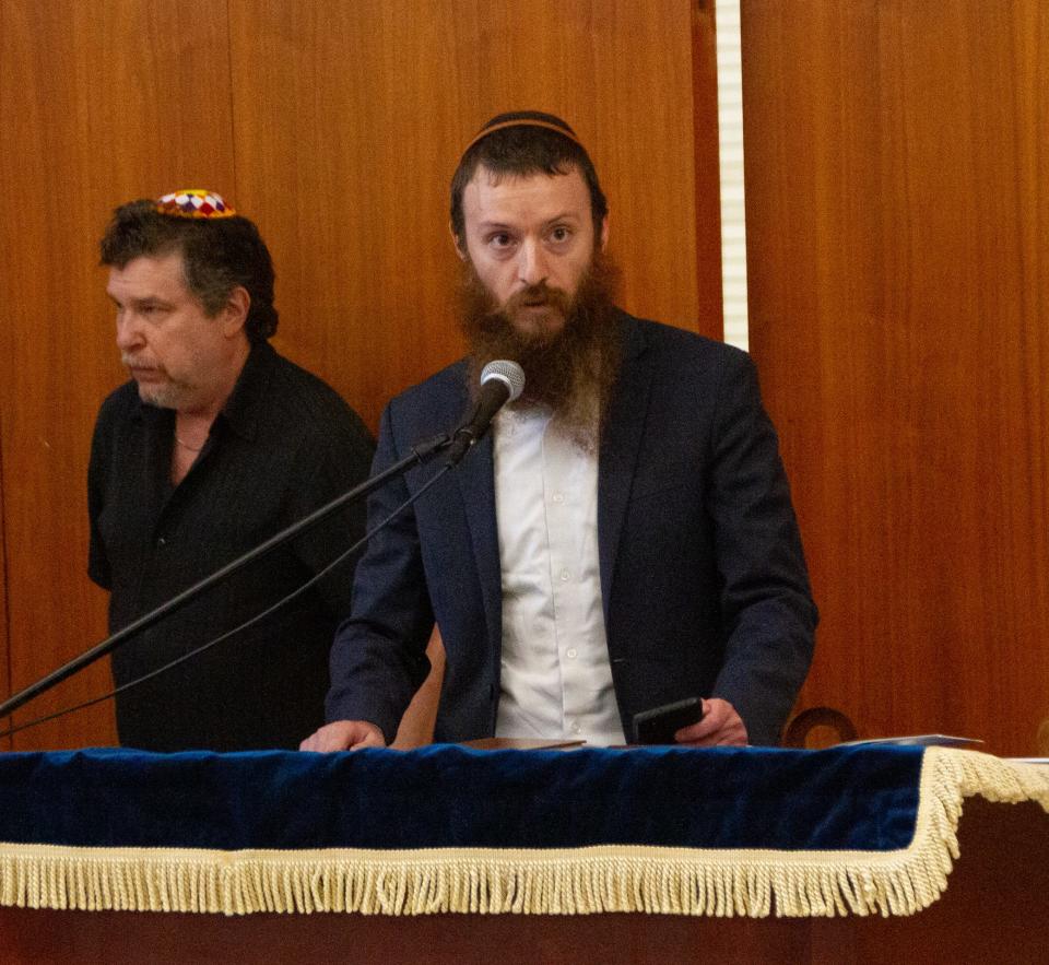 Rabbi Moshe Lazaros of Chabad Jewish Center addresses the audience during the "Stand with Israel" event Wednesday night at Temple Emanuel in Lakeland.