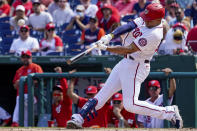 Washington Nationals' Juan Soto hits a solo home run during the third inning of a baseball game against the Colorado Rockies at Nationals Park, Sunday, Sept. 19, 2021, in Washington. (AP Photo/Andrew Harnik)