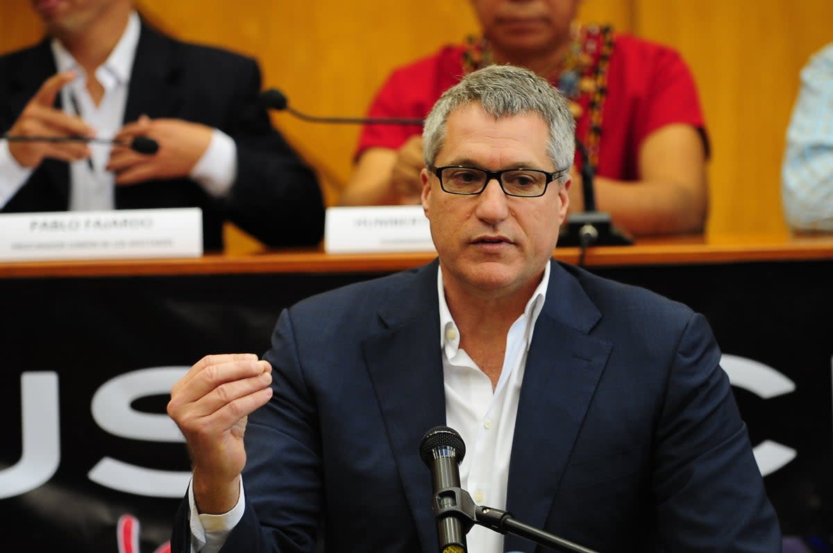 Steven Donziger speaking in Quito in 2014  (AFP via Getty Images)