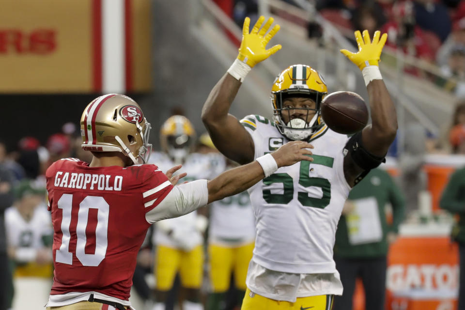 FILE - San Francisco 49ers quarterback Jimmy Garoppolo passes under pressure from Green Bay Packers outside linebacker Za'Darius Smith during the first half of the NFL NFC Championship football game Sunday, Jan. 19, 2020, in Santa Clara, Calif. NFL teams can always use more pass rushers, as evidenced by the NFC North where all four teams have spent big to acquire them over the last three years.(AP Photo/Matt York, File)