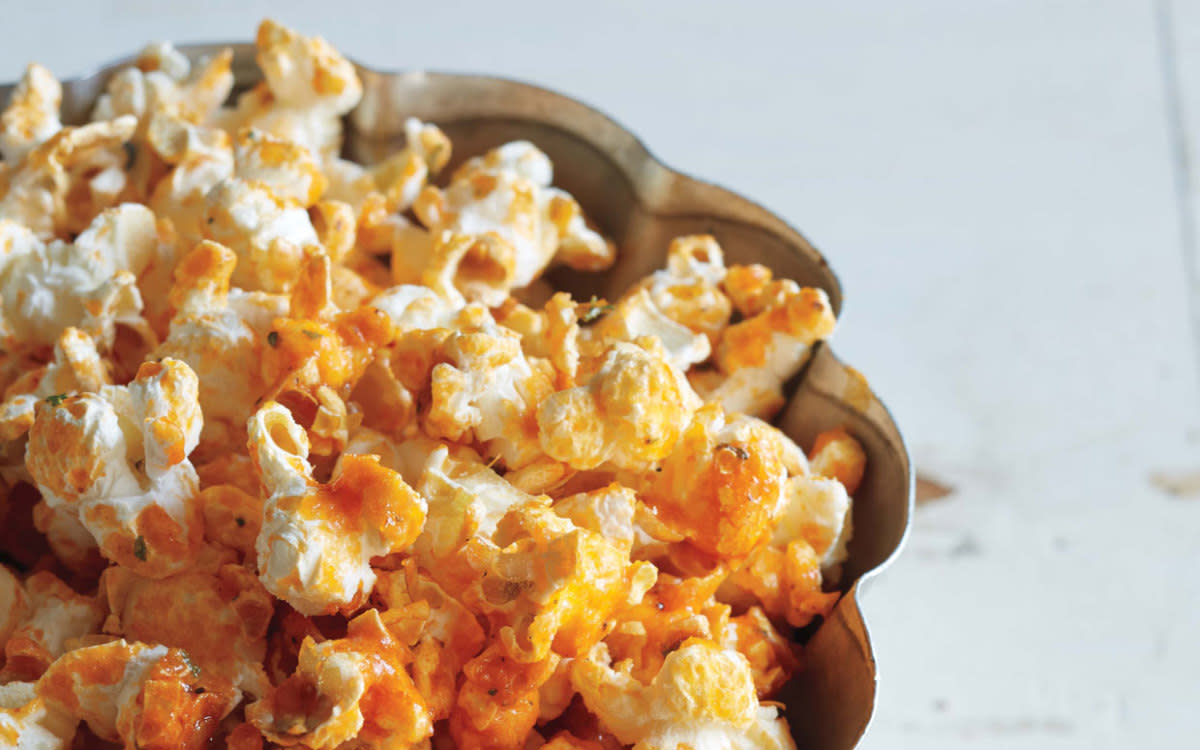 <p>ASHTON EPPS SWANK Ashton Epps Swank</p><p>Popcorn is the perfect canvas for buffalo sauce and ranch dressing. </p><p><strong>Get the recipe: <a href="/841264/communitytable/buffalo-ranch-popcorn/" data-ylk="slk:Buffalo Ranch Popcorn;elm:context_link;itc:0;sec:content-canvas" class="link rapid-noclick-resp">Buffalo Ranch Popcorn</a></strong></p>