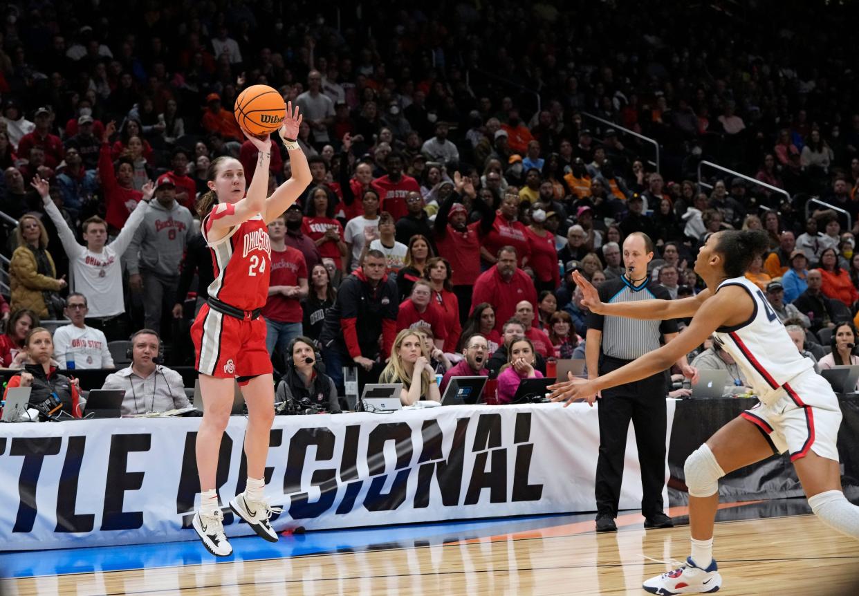 Ohio State guard Taylor Mikesell shoots over UConn forward Aubrey Griffin during a women's NCAA Tournament Sweet Sixteen game in Seattle last March.