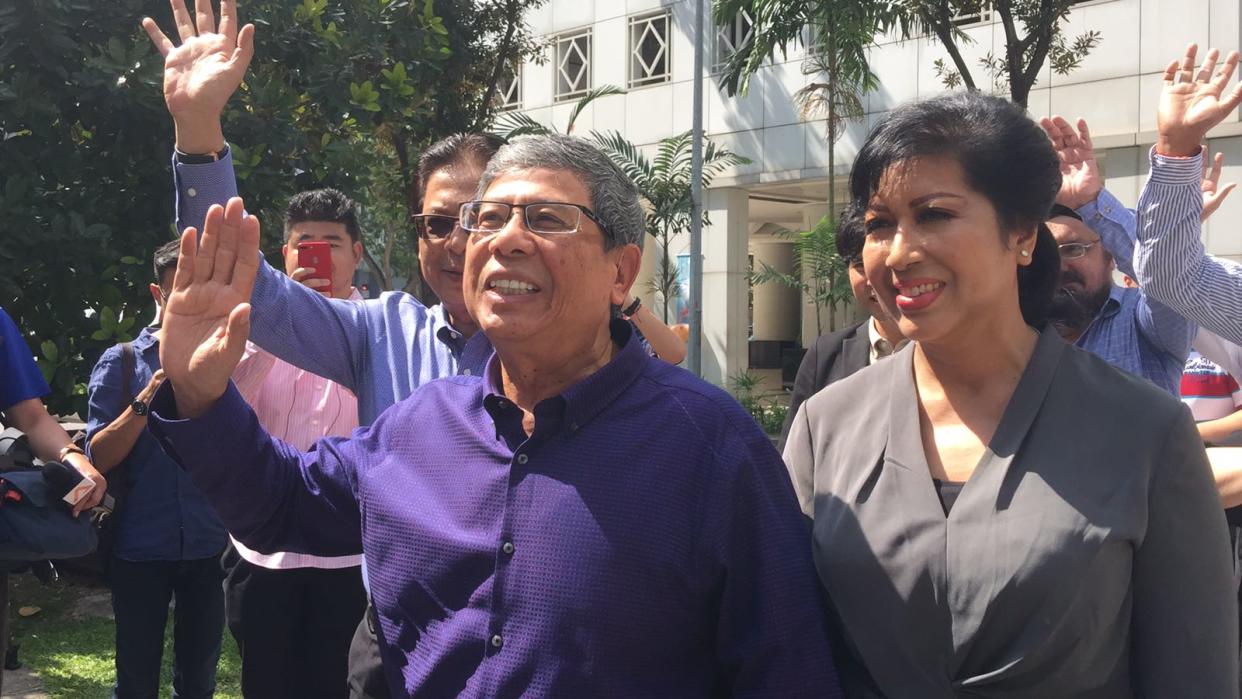 Presidential hopeful Salleh Marican with his wife Sapiyah Abu Bakar and supporters outside the Elections Department on Wednesday (23 August). (PHOTO: Gabriel Choo / Yahoo News Singapore)