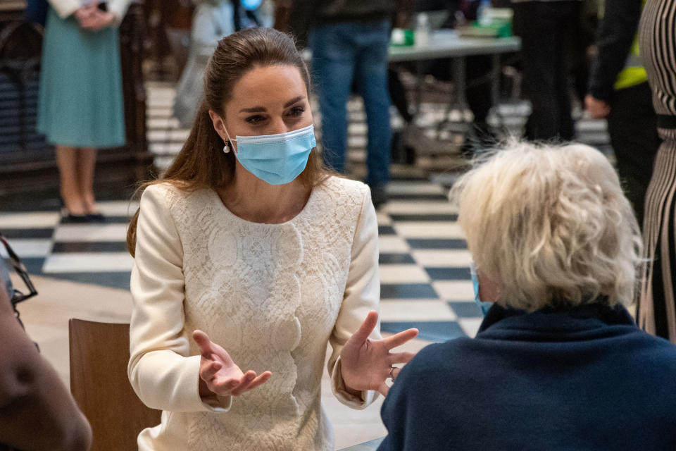 LONDON, ENGLAND - MARCH 23: Catherine, Duchess of Cambridge speaks with a member of the public during a visit to the Covid-19 vaccination centre at Westminster Abbey on March 23, 2021 in London, England. (Photo by Aaron Chown - WPA Pool/Getty Images)