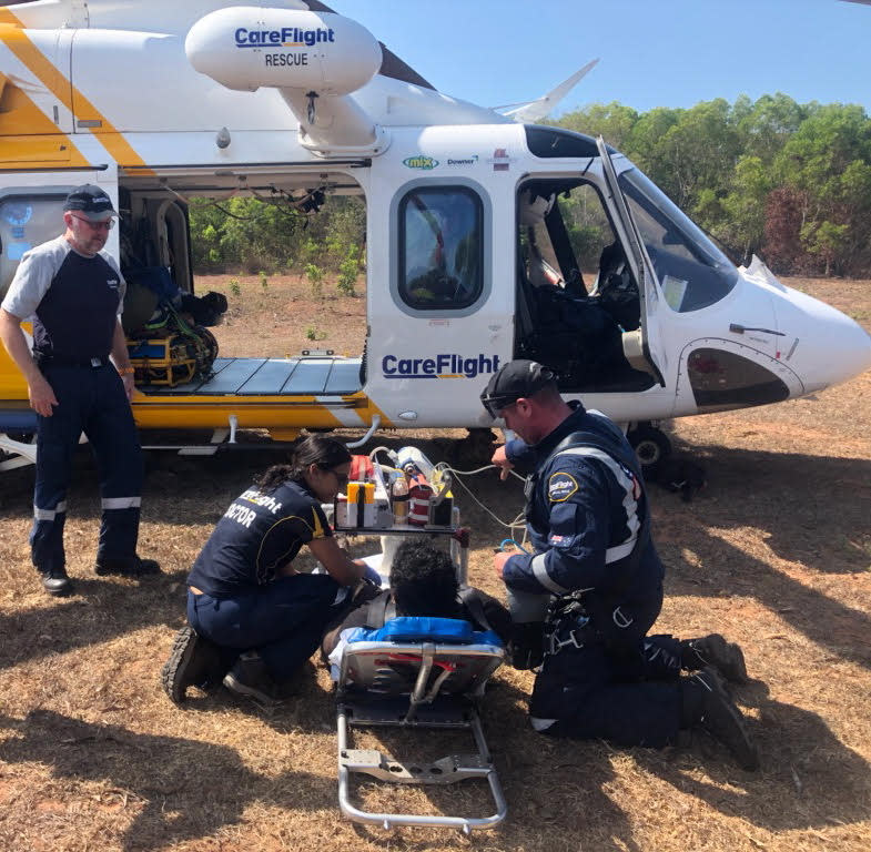 Picture of Elston Lami Lami on a stretcher before he was loaded into the Careflight helicopter in Minjilang.