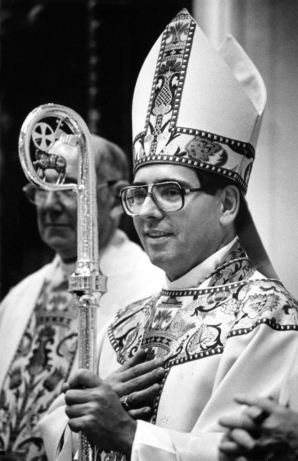 In this Journal Star file photo from Sept. 3, 1987, Bishop John J. Myers wears the new miter and ring and carries the staff as the new coadjutor bishop of the Catholic Diocese of Peoria.