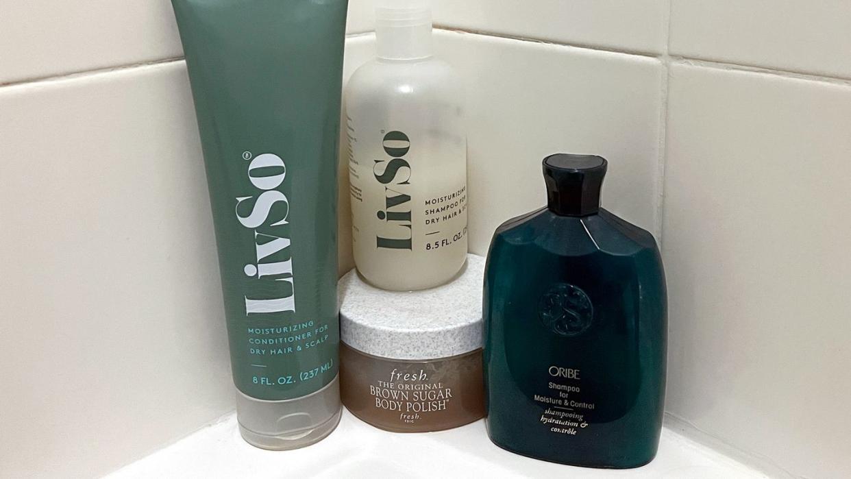 livso fresh and oribe shampoo in corner of shower