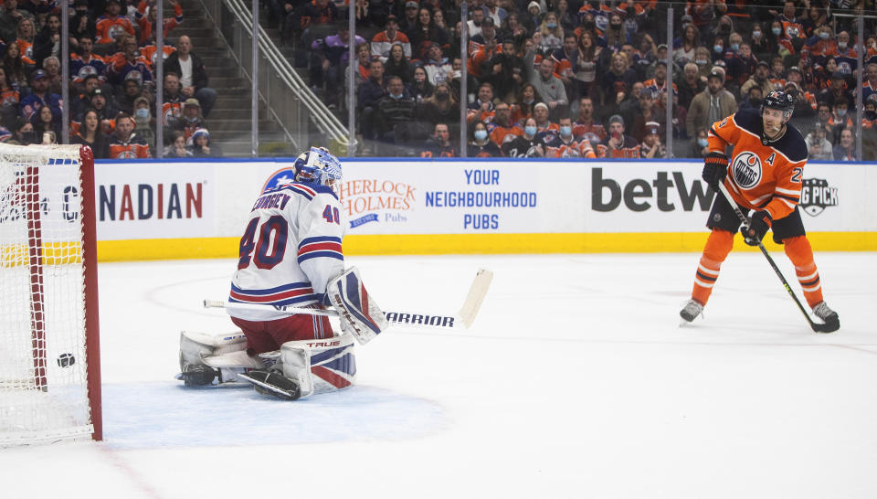 New York Rangers' goalie Alexandar Georgiev (40) gives up a goal to Edmonton Oilers Leon Draisaitl (29) during overtime in an NHL hockey game Friday, Nov. 5, 2021, in Edmonton, Alberta. (Jason Franson/The Canadian Press via AP)