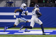 Tennessee Titans running back Derrick Henry (22) runs in for a touchdown past Indianapolis Colts outside linebacker Darius Leonard (53) in the first half of an NFL football game in Indianapolis, Sunday, Nov. 29, 2020. (AP Photo/Darron Cummings)