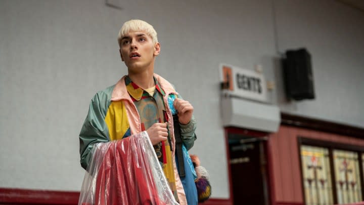 A young man with bleach blonde hair wearing a colorful outfit in Everybody's Talking About Jamie on Amazon Prime Video.