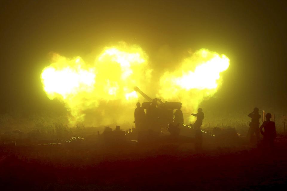 North Korean military performs a night drill of ground artillery sub-units.