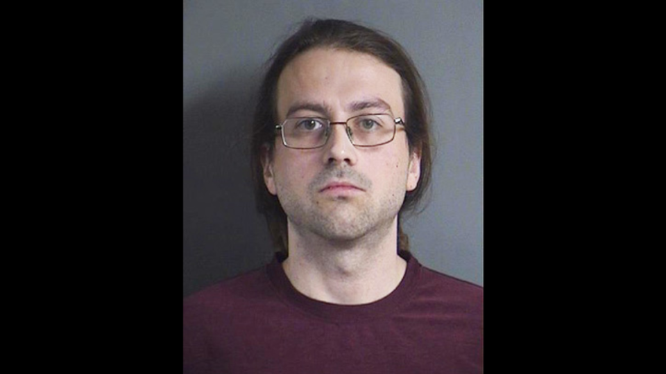 Nicholas Glasgow, 34, was arrested in Iowa on Friday after police say he beat up a fellow move-goer for using a phone during a film back in September. 
