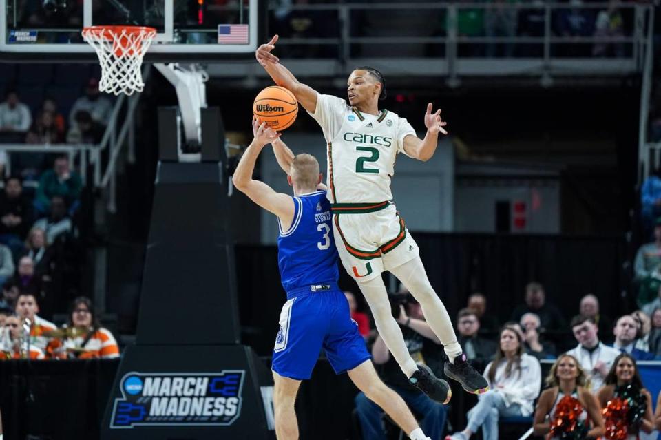 Miami Hurricanes guard Isaiah Wong (2) defends against Drake Bulldogs guard Garrett Sturtz (3) in MVP Arena on Friday in Albany, N.Y. 