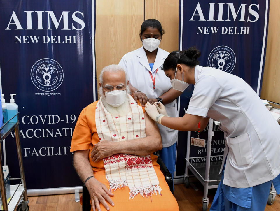 Indian Prime Minister Narendra Modi receives the second dose of the Covaxin coronavirus vaccine April 8 at a hospital in New Delhi. Modi spoke with the Biden Monday about receiving raw material for AstraZeneca vaccines. (Photo: Indian Press Information Bureau/Anadolu Agency via Getty Images)
