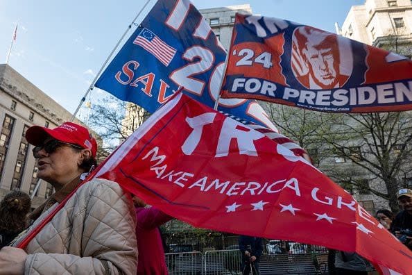 NEW YORK, NEW YORK - APRIL 15: Trump supporters, police and media gather outside of a the Manhattan Criminal Courthouse for the start of first-ever criminal trial against a former president of the United States on April 15, 2024 in New York City. Former President Donald Trump faces 34 felony counts of falsifying business records in the first of his criminal cases to go to trial. (Photo by Spencer Platt/Getty Images)