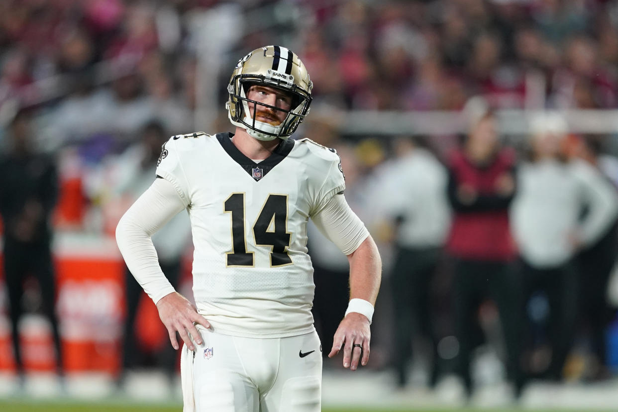 New Orleans Saints quarterback Andy Dalton (14) had a wild first half against the Cardinals. (AP Photo/Matt York)