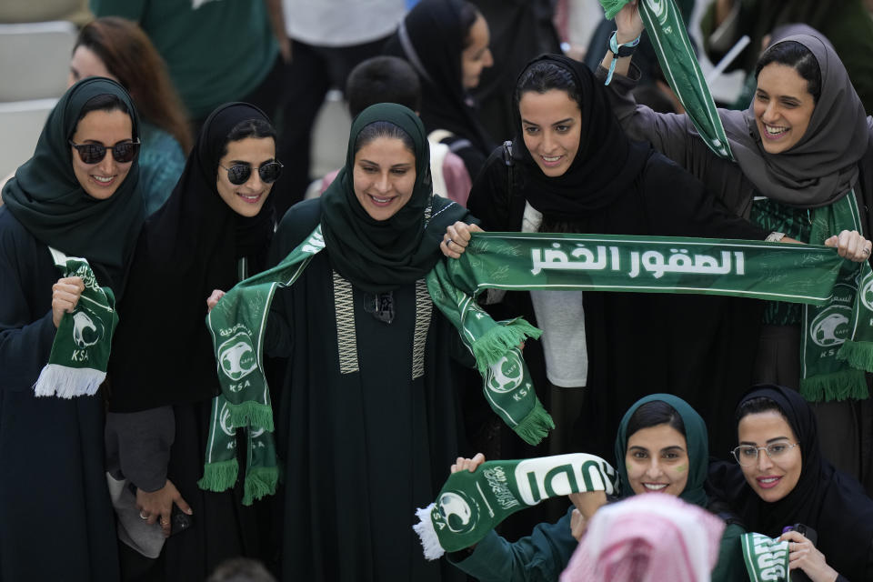 FILE - Saudi women supporters celebrate after Saudi Arabia won the World Cup group C soccer match between Argentina and Saudi Arabia at the Lusail Stadium in Lusail, Qatar, on Nov. 22, 2022. (AP Photo/Luca Bruno, File)