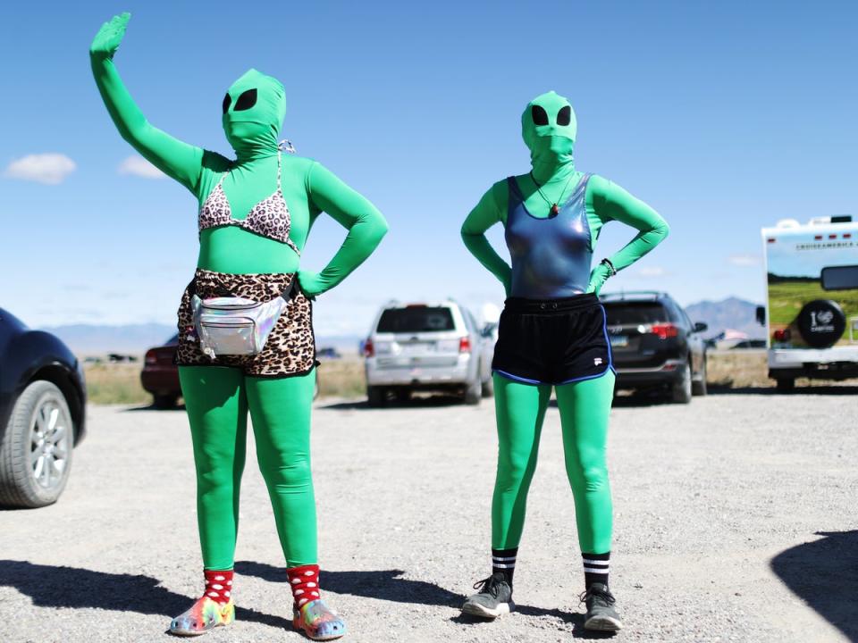 Women dressed as aliens at a Storm Area 51 spinoff event called Alienstock in Rachel, Nevada, in 2019 (Getty)