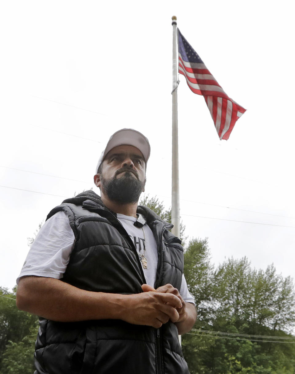 Jose Robles walks into a U.S. Immigration and Customs Enforcement office Wednesday, July 17, 2019, in Tukwila, Wash. Robles, who has spent the past year inside a Seattle church to avoid being deported to Mexico, has been detained. The arrest Wednesday prompted protests from a crowd of supporters who had accompanied Robles to the agency. His deportation has temporarily been put on hold by a federal appeals court, and he has a pending visa application. (AP Photo/Elaine Thompson)