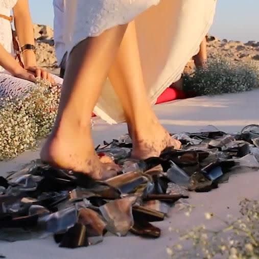 Would you walk on broken glass for your partner? Photo: Caters