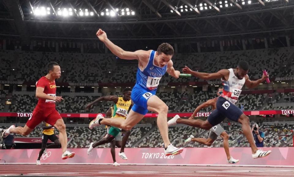 Filippo Tortu of Italy crosses the line to win gold in the 4x100m relay.