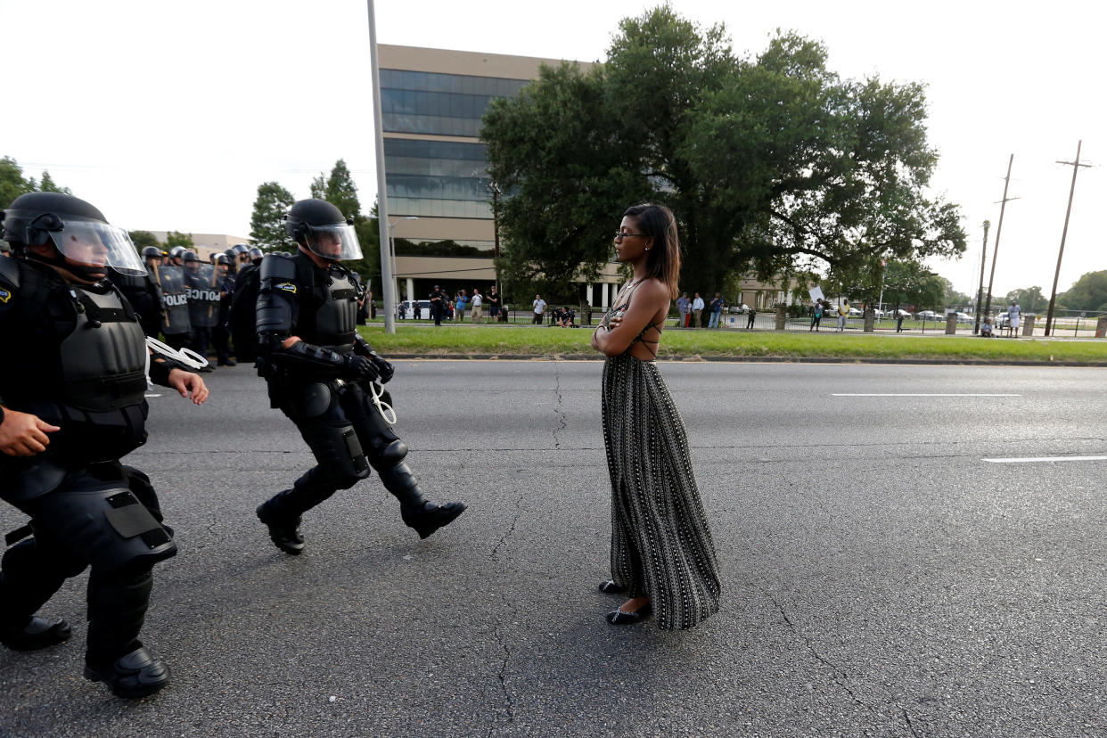 Protestor Ieshia Evans is approached by law enforcement near the headquarters of the Baton Rouge Police Department in Baton Rouge, Louisiana, U.S. July 9, 2016.   REUTERS/Jonathan Bachman          SEARCH "#BLACK LIVES MATTER" FOR THIS STORY. SEARCH "THE WIDER IMAGE" FOR ALL STORIES.