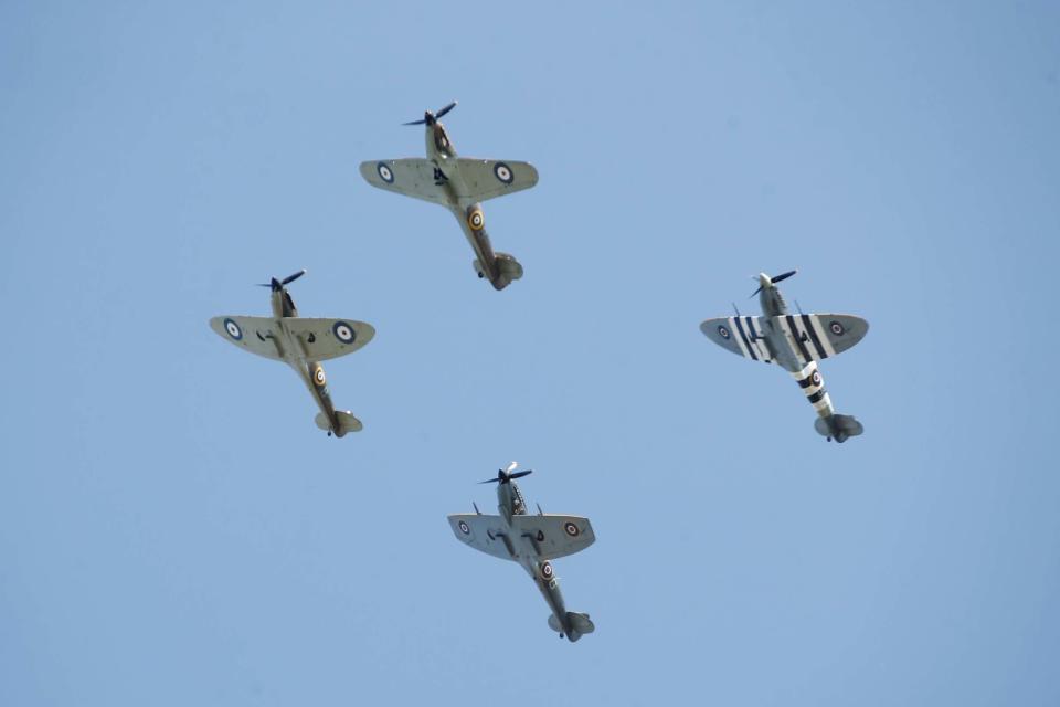 The Royal Airforce's Spitfire planes fly over Westminster Abbey (REUTERS)