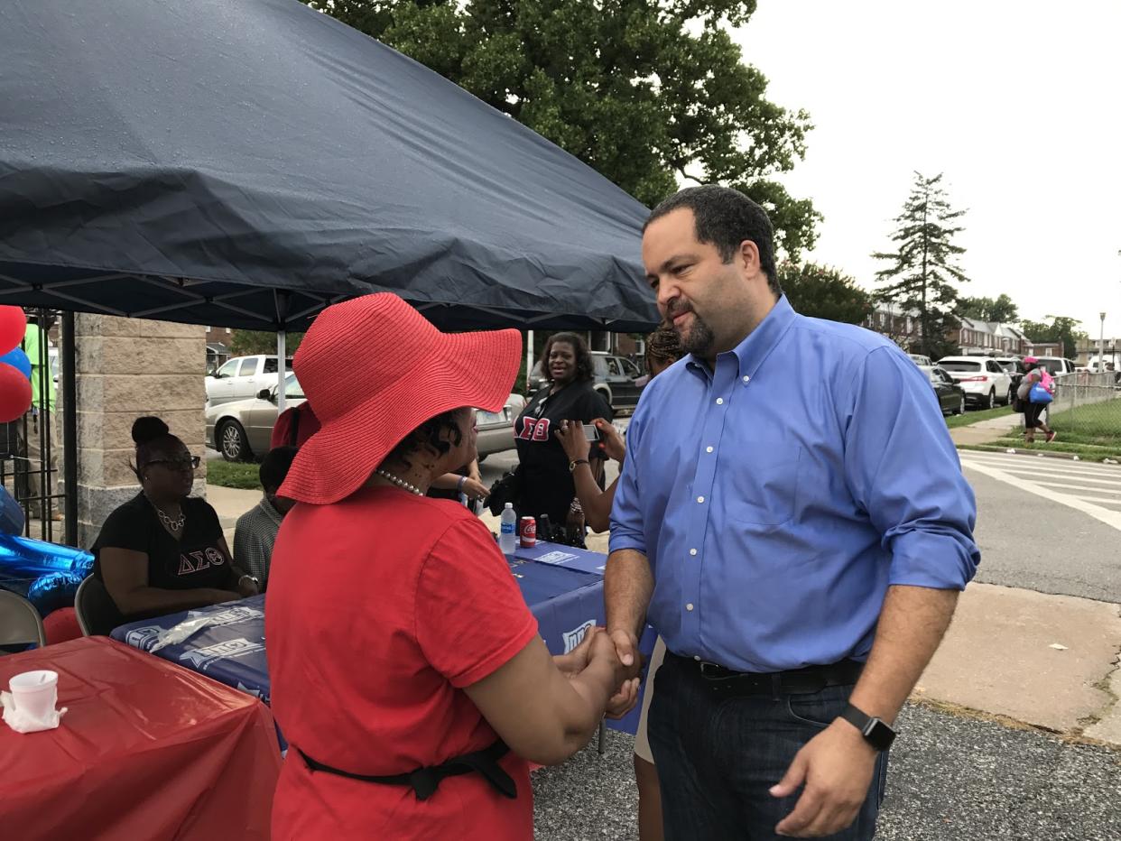 Ben Jealous speaks with a voter at an event in West Baltimore. (Photo: Andrew Bahl/Yahoo News)