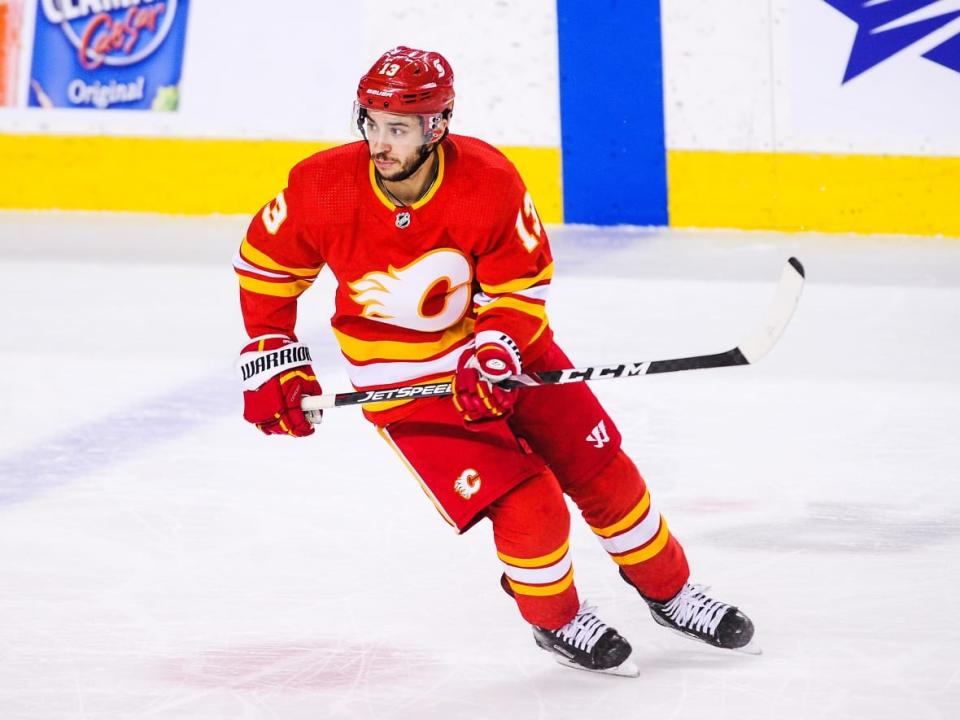 Johnny Gaudreau (13) of the Calgary Flames, seen in a file photo from March 2021, has signed a seven-year deal worth over $68 million US with the Columbus Blue Jackets according to multiple reports. (Derek Leung/Getty Images - image credit)