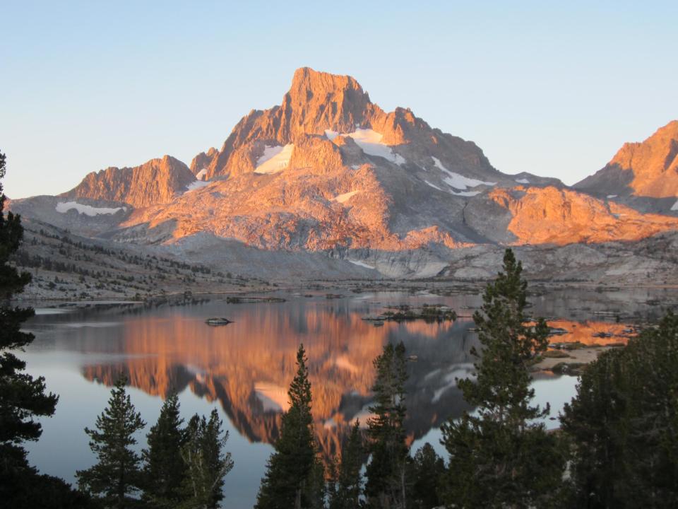 CORRECTS TO SAY THAT THE ANSEL ADAMS WILDERNESS IS OUTSIDE YOSEMITE INSTEAD OF INSIDE - This Sept. 25, 2012 photo shows Banner Peak in the Ansel Adams Wilderness outside Yosemite National Park in California. Yosemite is one of the most visited parks in the national park system, but a hiking trip to the backcountry can offer access to uncrowded, pristine areas. (AP Photo/John Pain)