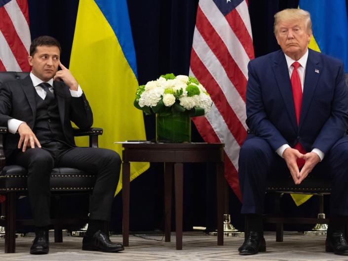 US President Donald Trump and Ukrainian President Volodymyr Zelensky looks on during a meeting in New York (AFP via Getty Images)