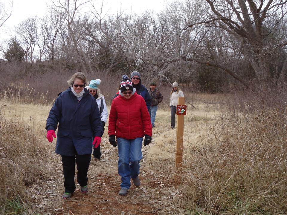 Bundled up against the cold weather, people participate in a First Day Hike at Foss State Park.