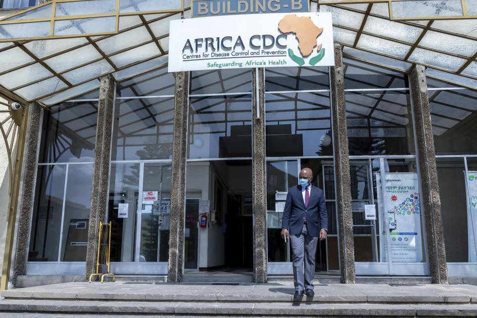 John Nkengasong, director of the Africa Centers for Disease Control and Prevention, walks outside the organization's headquarters in Addis Ababa, Ethiopia Monday, Sept. 14, 2020. The coronavirus pandemic has fractured global relationships as governments act in the interest of their citizens first, but as Africa's top public health official, Nkengasong has helped to steer the continent's 54 countries into an alliance that has won praise as responding better than some richer nations. (Mulugeta Ayene via AP)