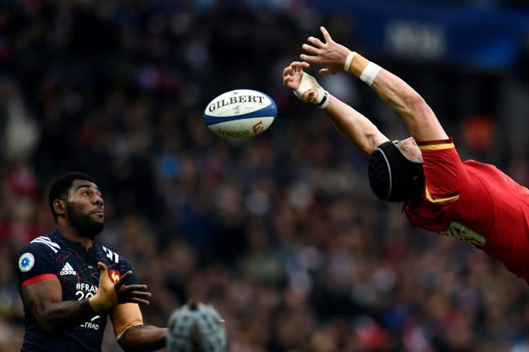 France's winger Noa Nakaitaci (L) tries to grab the ball despite Wales' Samson Lee during the Six Nations tournament Rugby Union match March 18, 2017