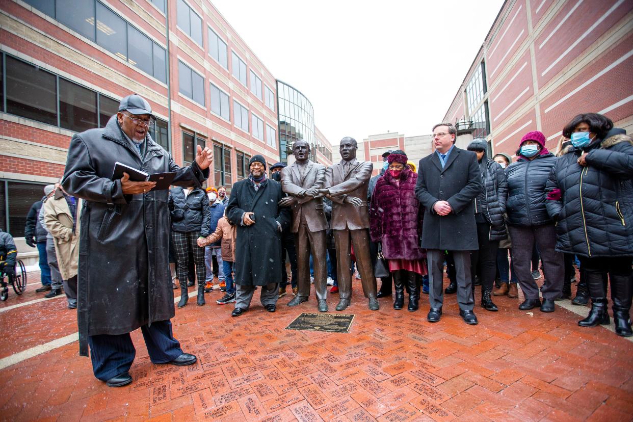 Pastor Odell Hughes addresses the crowd after joining the traditional Martin Luther King holiday march from the County-City Building to the statue of the Rev. Theodore M. Hesburgh and the Rev. Martin Luther King Jr. on Feb. 17, 2022, in South Bend. Last year's events were delayed a month because of COVID-19 concerns.