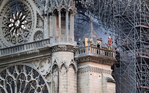 National mourning over the damage done to Notre-Dame Cathedral has continued into the second day - Credit: Gareth Fuller/PA
