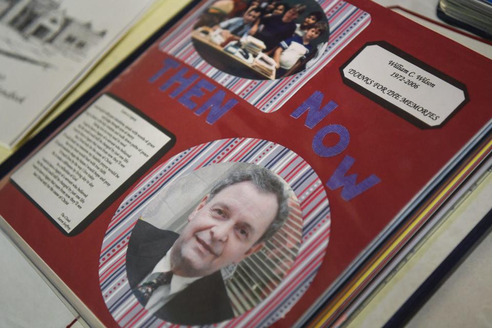 Scrapbooks given to West Valley Middle School's founding principal William Wilson are on display at a celebration for the school's 25th anniversary.
