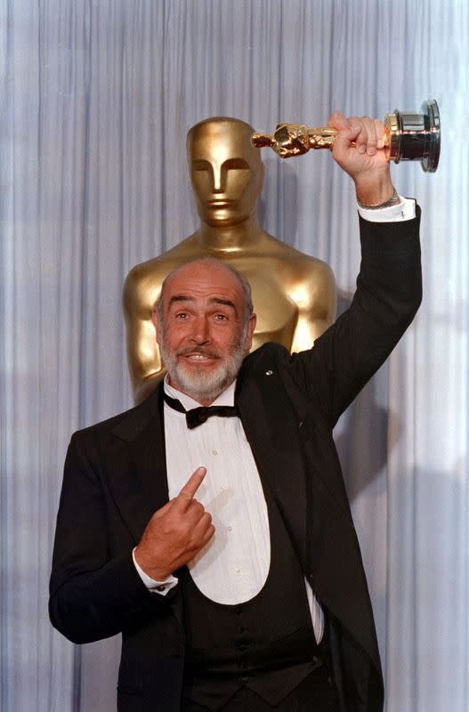 FILE PHOTO: Actor Sean Connery holds up his Oscar after winning Best Supporting Actor at the 60th Academy Awards in Los Angeles