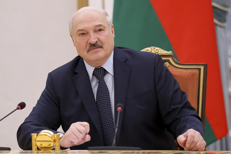 FILE - In this May 28, 2021, file photo, Belarus President Alexander Lukashenko addresses prime ministers from countries that were once part of the former Soviet Union at a meeting, in Minsk, Belarus. Dissident journalist Raman Pratasevich arrested when Belarus diverted his flight has said in a video released Wednesday June 2, 2021, from prison that he has been set up by an unidentified associate. Lukashenko, who has ruled the ex-Soviet nation of 9.3 million with an iron fist for more than a quarter-century, has accused the West of trying to "strangle" his country with sanctions.(Sergei Sheleg/BelTA Pool Photo via AP, File)