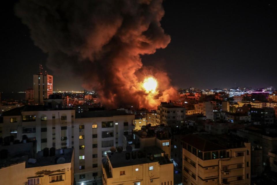 Smoke rises from the internal security building of Hamas interior ministry after Israeli air strikes in Gaza City today. Quider and six fighters were killed after Israeli air strikes in the east of Khan Younis town southern Gaza Strip a night earlier (EPA)