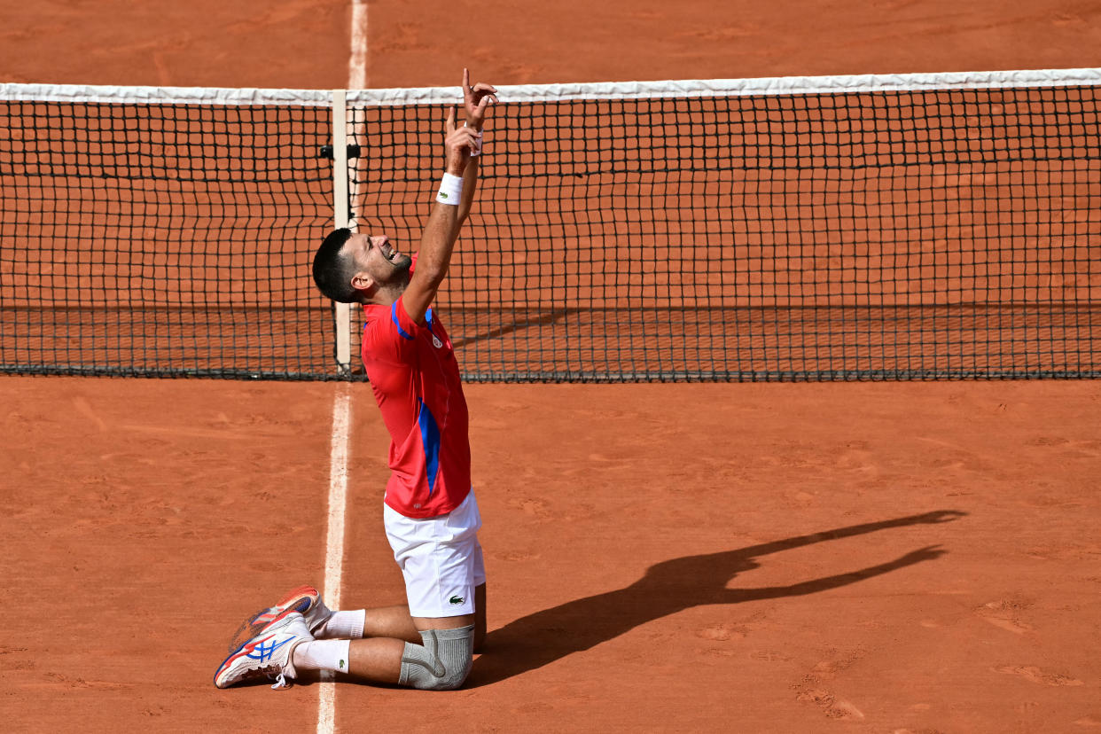 Serbia's Novak Djokovic reacts to beating Spain's Carlos Alcaraz in their men's singles final tennis match on Court Philippe-Chatrier at the Roland-Garros Stadium during the Paris 2024 Olympic Games, in Paris on August 4, 2024. (Photo by Miguel MEDINA / AFP) (Photo by MIGUEL MEDINA/AFP via Getty Images)