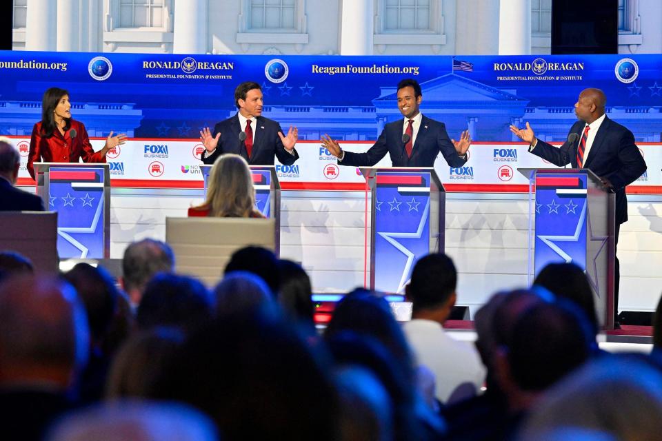 (From left) Former South Carolina Gov. Nikki Haley, Florida Gov. Ron DeSantis, businessman Vivek Ramaswamy and South Carolina Sen. Tim Scott speak during the FOX Business Republican presidential primary debate at the Ronald Reagan Presidential Library and Museum on Wednesday Sept. 28.