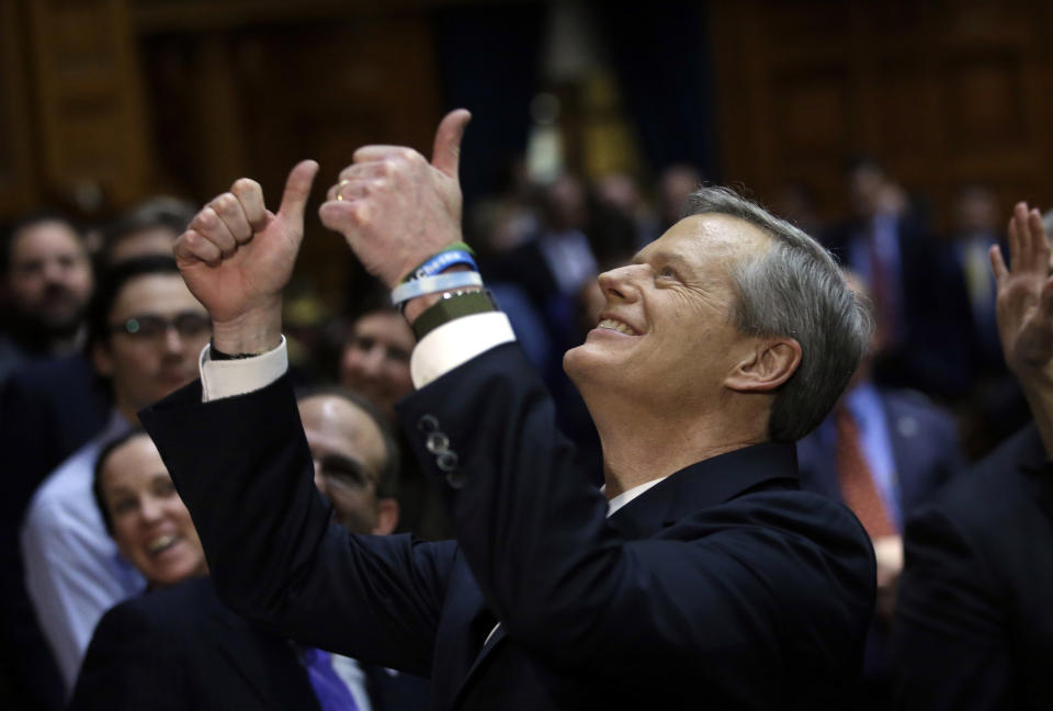 FILE - Massachusetts Gov. Charlie Baker gives a thumbs-up to people in the balcony audience of the House Chamber as he departs after delivering his state of the state address, Tuesday, Jan. 21, 2020, at the Statehouse, in Boston. Charlie Baker will be the next president of the NCAA, replacing Mark Emmert as the head of the largest college sports governing body in the country.(AP Photo/Steven Senne, File)