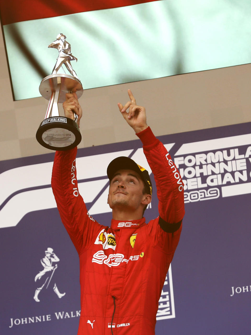 Ferrari driver Charles Leclerc of Monaco lifts the trophy after finishing first in the Belgian Formula One Grand Prix in Spa-Francorchamps, Belgium, Sunday, Sept. 1, 2019. Mercedes driver Lewis Hamilton of Britain placed second and Mercedes driver Valtteri Bottas of Finland placed third. (AP Photo/Francisco Seco)