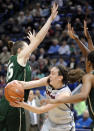 Connecticut's Breanna Stewart, center, passes around South Florida's Katelyn Weber (45) during the first half of an NCAA college basketball game in Hartford, Conn., Sunday, Jan. 26, 2014. (AP Photo/Fred Beckham)